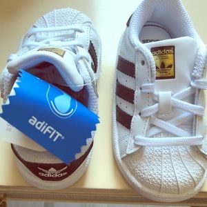 Adidas superstar toddler sneakers.